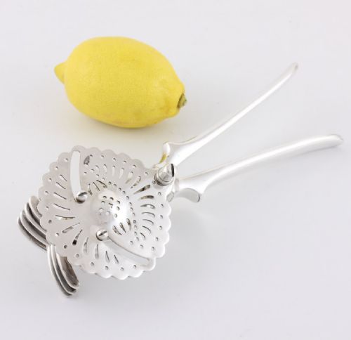 fig 1. Silver Plate Lemon Juicer.