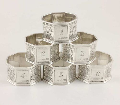 Six Octagonal Solid Silver Numbered Napkin Rings.