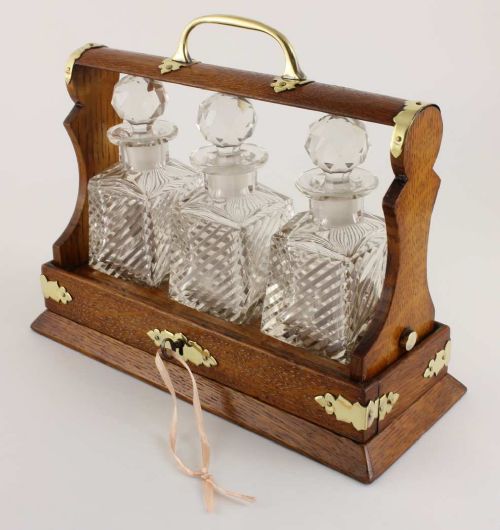 fig 1. Oak & Brass Miniature Three Cut Glass Decanter Tantalus. Excelsior 1903.
