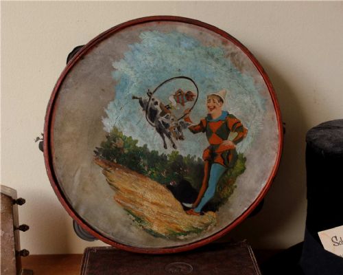 fig 1. Folk Art Oil Painting on Tambourine of a Clown, Monkey Jockey on Pig.