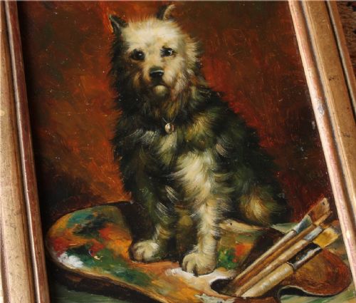 fig 1. An antique framed oil painting depicting a small terrier dog sitting beside an artists palette and paintbrushes against a dark warm background.
