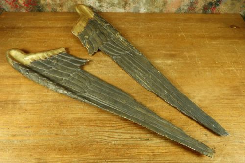 fig 1. A pair of hand-carved wooden angel wings featuring gilded upper shoulders and detailed feathers with an aged grey patina.