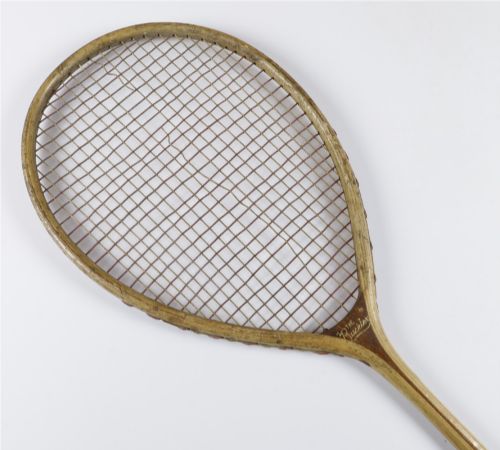 fig 1. An antique Slazenger wooden badminton racket with a steam-bent frame, stringing, and a long wooden shaft.