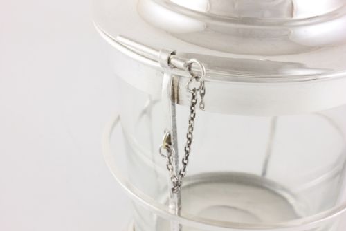 fig 3. A silver-plated and clear glass ice bucket designed in the form of a nautical ships lantern with a removable lid and chain detail.