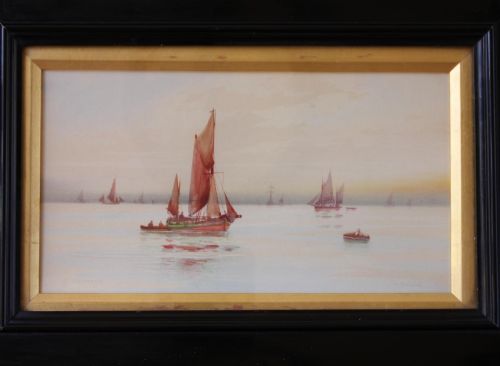 fig 1. A framed early twentieth-century watercolour painting featuring red-sailed fishing boats on calm waters off Scarborough, enclosed in a thick black frame with a gold inner slip.