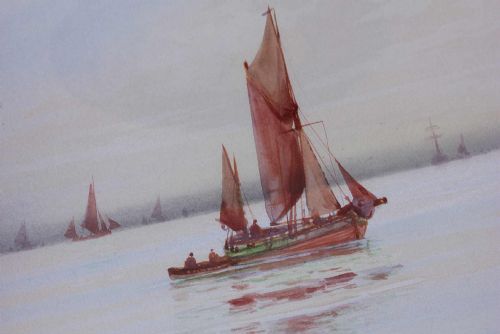 fig 2. A framed early twentieth-century watercolour painting featuring red-sailed fishing boats on calm waters off Scarborough, enclosed in a thick black frame with a gold inner slip.
