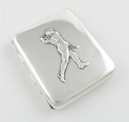 fig 1. An Edwardian sterling silver cigarette case featuring an embossed relief figure of a golfer in mid-swing on the front cover.