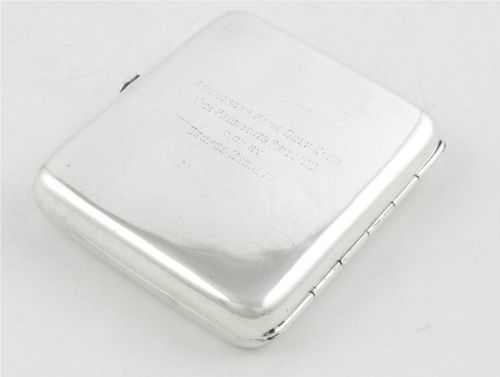 fig 4. An Edwardian sterling silver cigarette case featuring an embossed relief figure of a golfer in mid-swing on the front cover.
