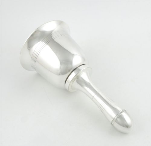 fig 3. A silver plated novelty cocktail shaker in the shape of a handbell with a smooth turned handle and incised line detailing.