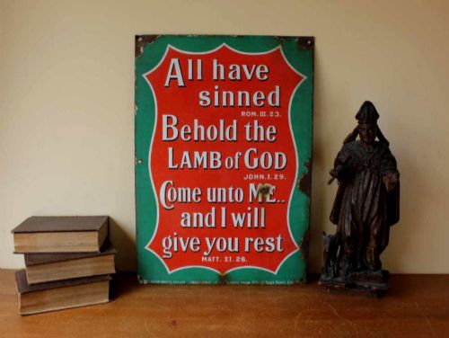 fig 1. A rectangular vitreous enamel sign with a green background and a red central cartouche displaying white and black printed scripture texts.