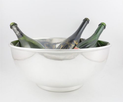 fig 1. A large polished silver-plated champagne cooler bowl featuring a smooth circular basin, rolled rim, and pedestal base.