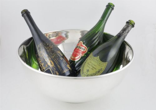 fig 2. A large polished silver-plated champagne cooler bowl featuring a smooth circular basin, rolled rim, and pedestal base.