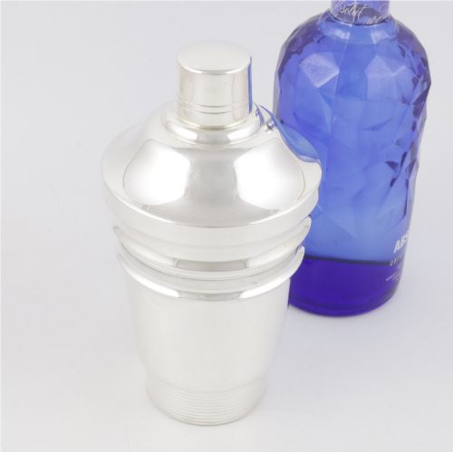 fig 1. A 1930s Art Deco silver-plated cocktail shaker featuring stepped geometric contours and fine engine-turned band details.