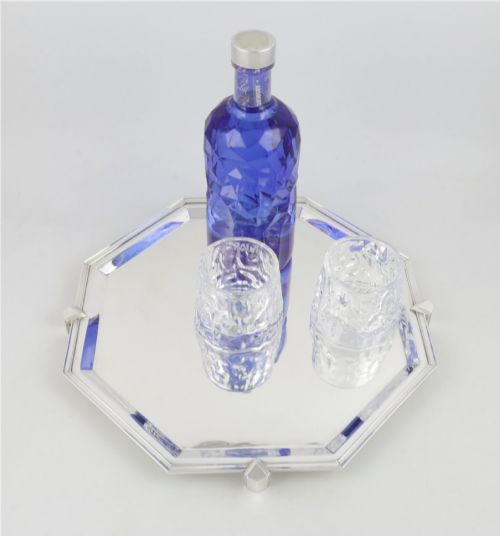 fig 1. An octagonal silver-plated Art Deco cocktail tray featuring geometric corner accents and a polished smooth surface.