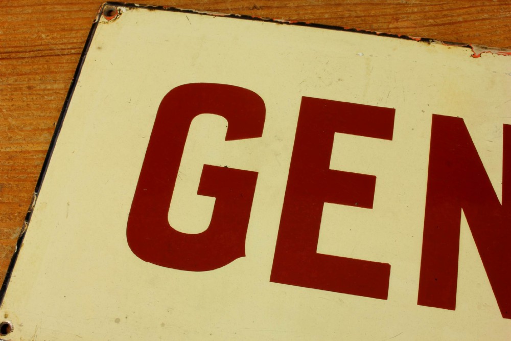 An antique rectangular off-white vitreous enamel sign displaying bold burgundy typography reading GENTLEMEN with patinated edges. View VIII