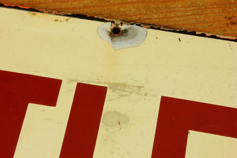 An antique rectangular off-white vitreous enamel sign displaying bold burgundy typography reading GENTLEMEN with patinated edges. View XVI