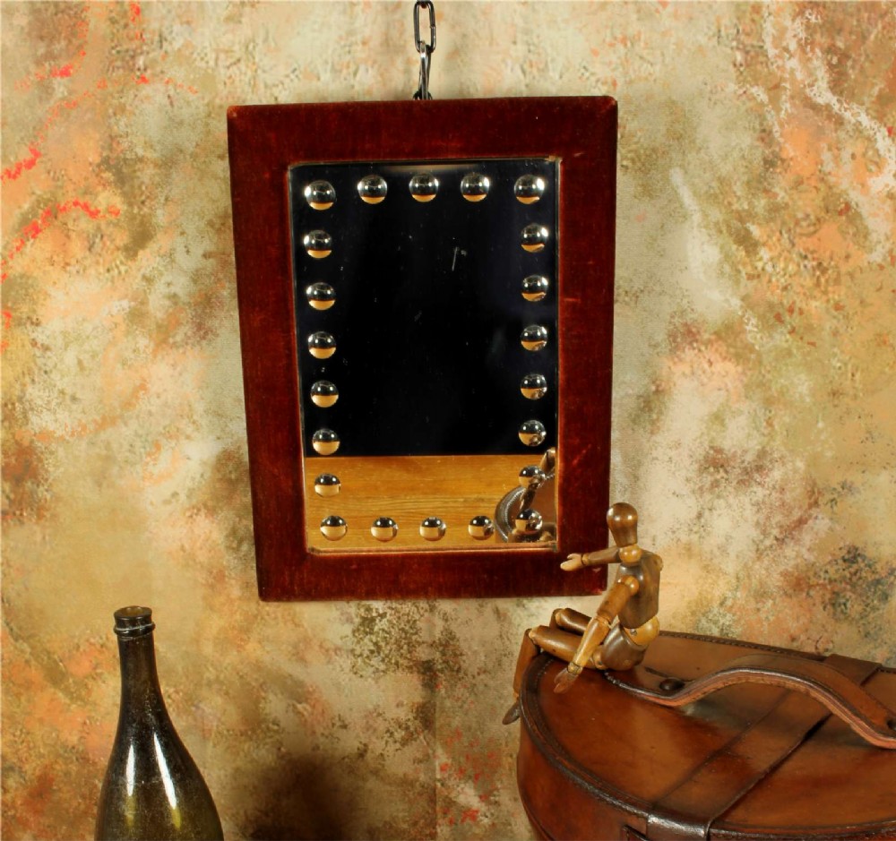 A rectangular Victorian wall mirror featuring a red velvet frame and a perimeter of circular convex lenses cut into the glass. View II