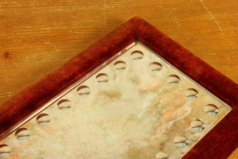 A rectangular Victorian wall mirror featuring a red velvet frame and a perimeter of circular convex lenses cut into the glass. View XIII