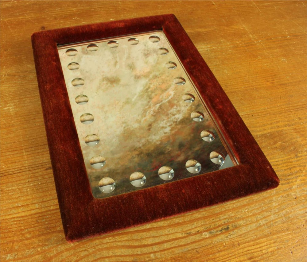 A rectangular Victorian wall mirror featuring a red velvet frame and a perimeter of circular convex lenses cut into the glass. View XIV