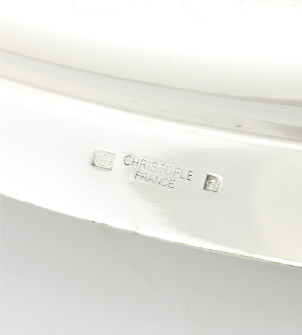 An extra large oval silver-plated tray with reeded border detail and two outer scroll handles on a plain background. View VIII