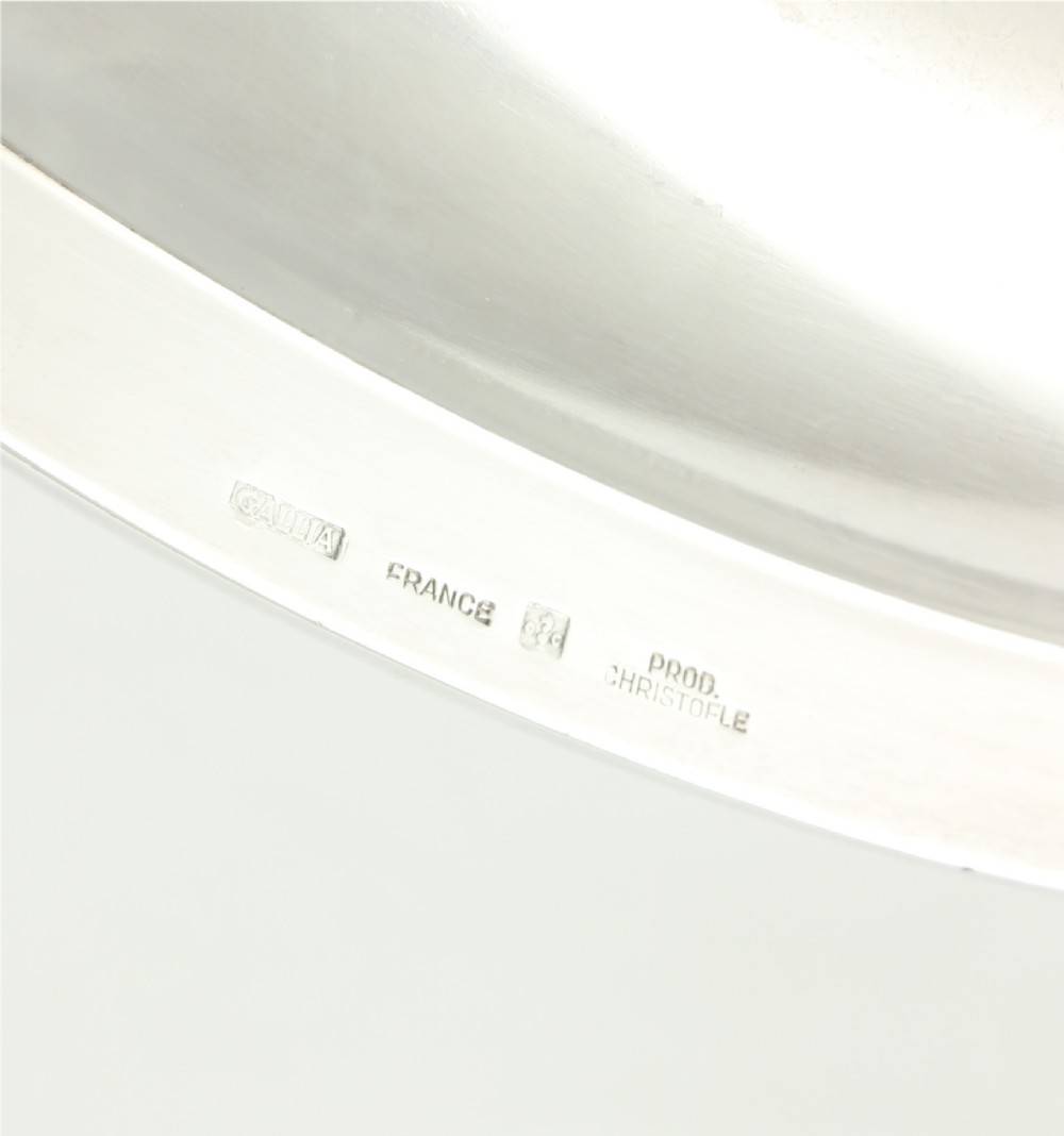 A silver-plated sauce boat featuring a sculpted eagle head handle set upon an integrated oval underplate. View VII