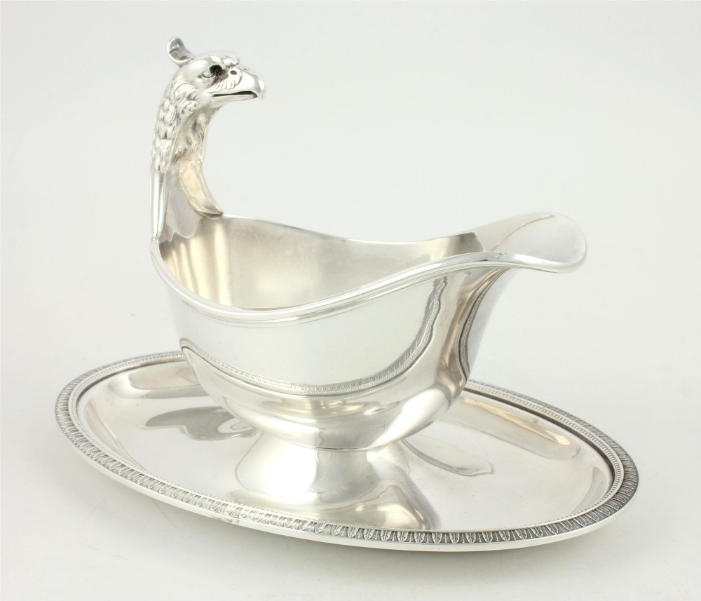 A silver-plated sauce boat featuring a sculpted eagle head handle set upon an integrated oval underplate. View XIV