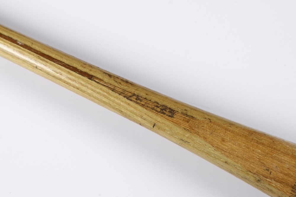 An antique Slazenger wooden badminton racket with a steam-bent frame, stringing, and a long wooden shaft. View VIII