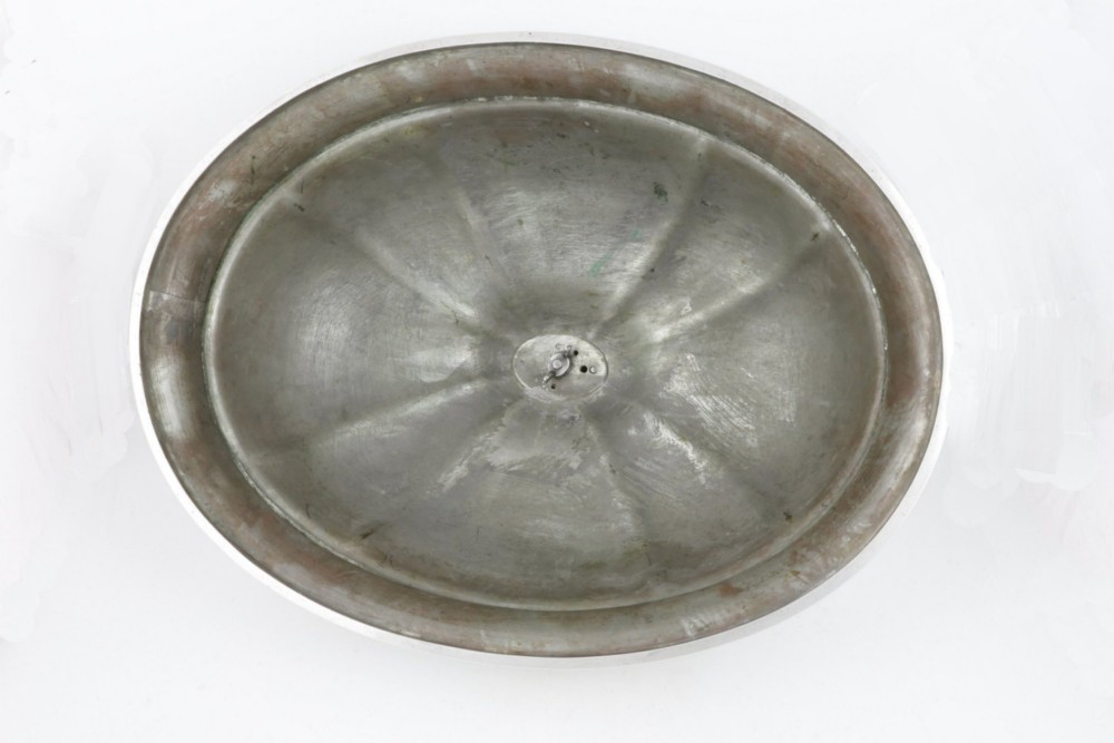 A Georgian Old Sheffield plate silver meat dome featuring a fluted body, an engraved heraldic coat of arms, and a cast handle adorned with vine leaves and grapes. View IX