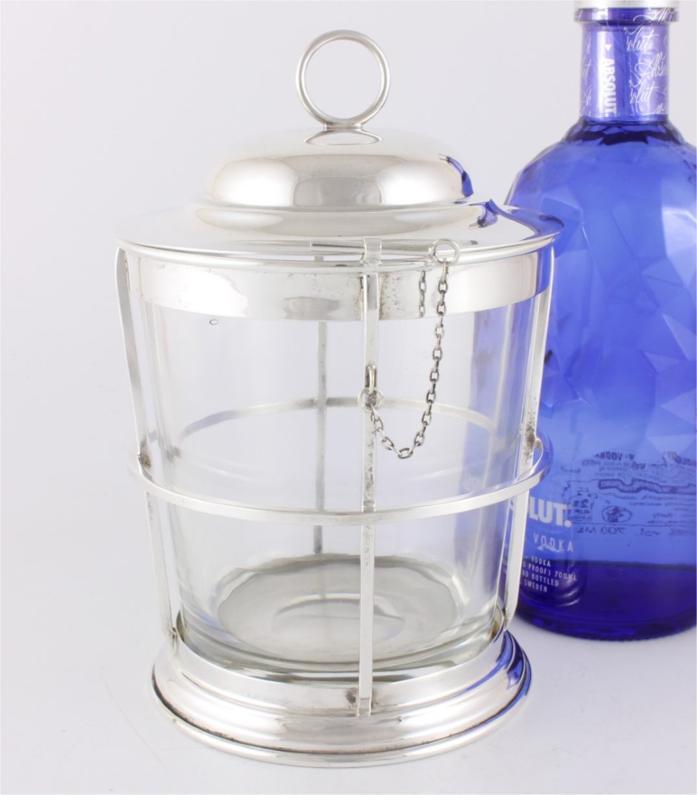 A silver-plated and clear glass ice bucket designed in the form of a nautical ships lantern with a removable lid and chain detail.