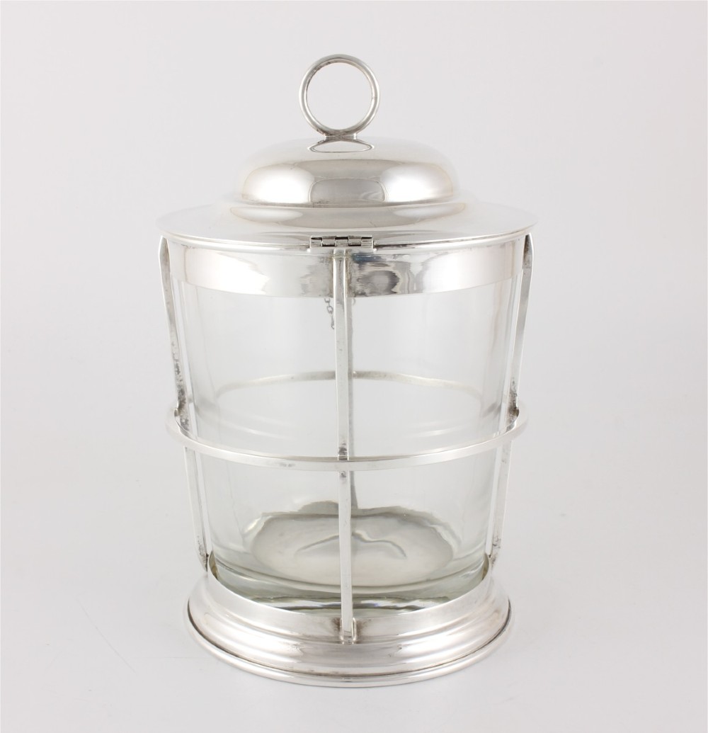 A silver-plated and clear glass ice bucket designed in the form of a nautical ships lantern with a removable lid and chain detail. View VII