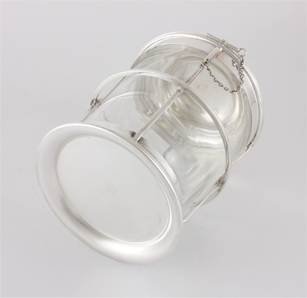 A silver-plated and clear glass ice bucket designed in the form of a nautical ships lantern with a removable lid and chain detail. View X