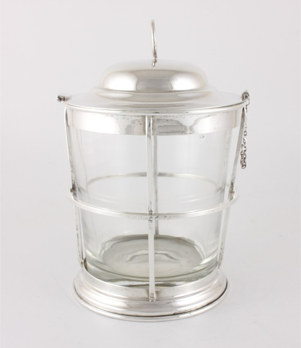 A silver-plated and clear glass ice bucket designed in the form of a nautical ships lantern with a removable lid and chain detail. View XI