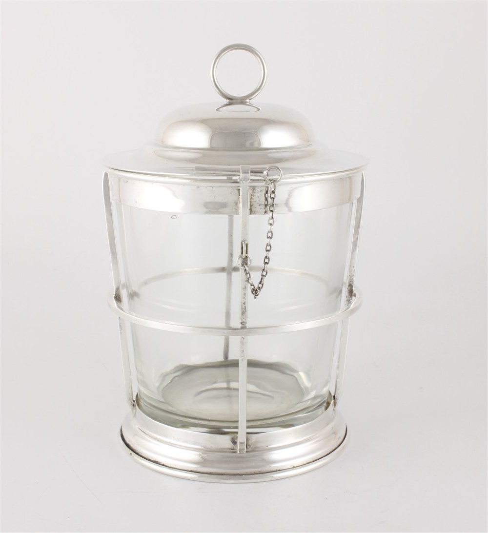 A silver-plated and clear glass ice bucket designed in the form of a nautical ships lantern with a removable lid and chain detail. View XII