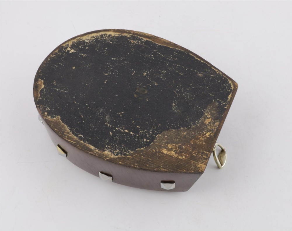 An antique horseshoe-shaped dark oak games box featuring silver metal scrollwork, playing card motifs, and an integrated cribbage scoring track. View X