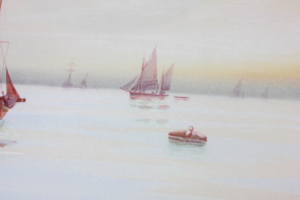 A framed early twentieth-century watercolour painting featuring red-sailed fishing boats on calm waters off Scarborough, enclosed in a thick black frame with a gold inner slip. View X