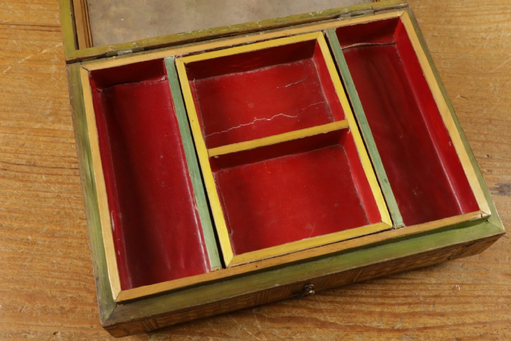 A rectangular wooden box top featuring intricate straw marquetry depicting a harbour landscape with ships, fortresses, and geometric borders. View VII