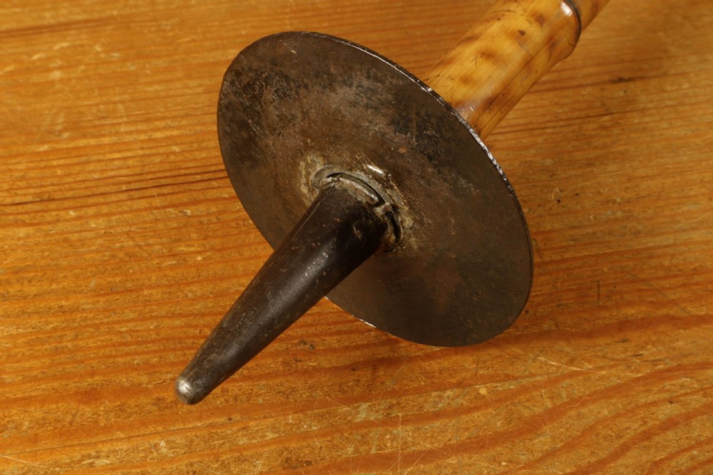 A late 19th-century bamboo shooting stick featuring a folding seat handle, metal support struts, and a spiked metal base. View XV