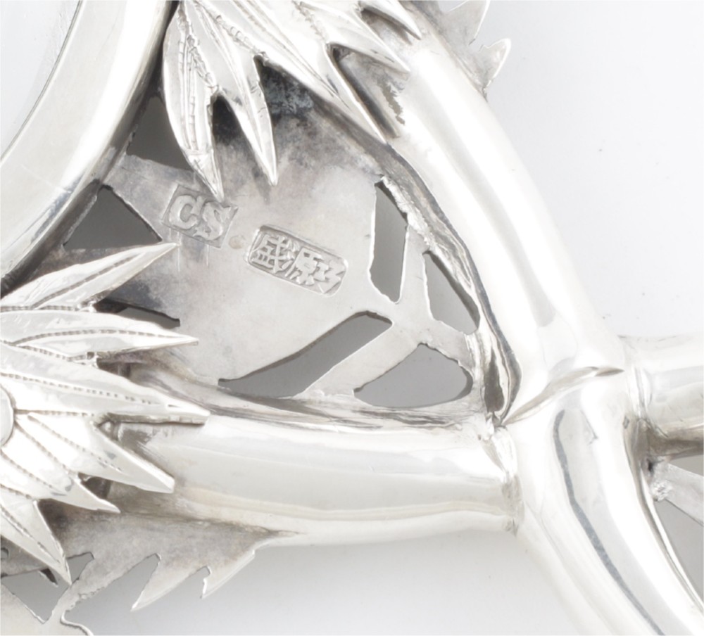 An antique silver hand mirror featuring a dragon motif frame and an interconnected faux-bamboo handle. View XI