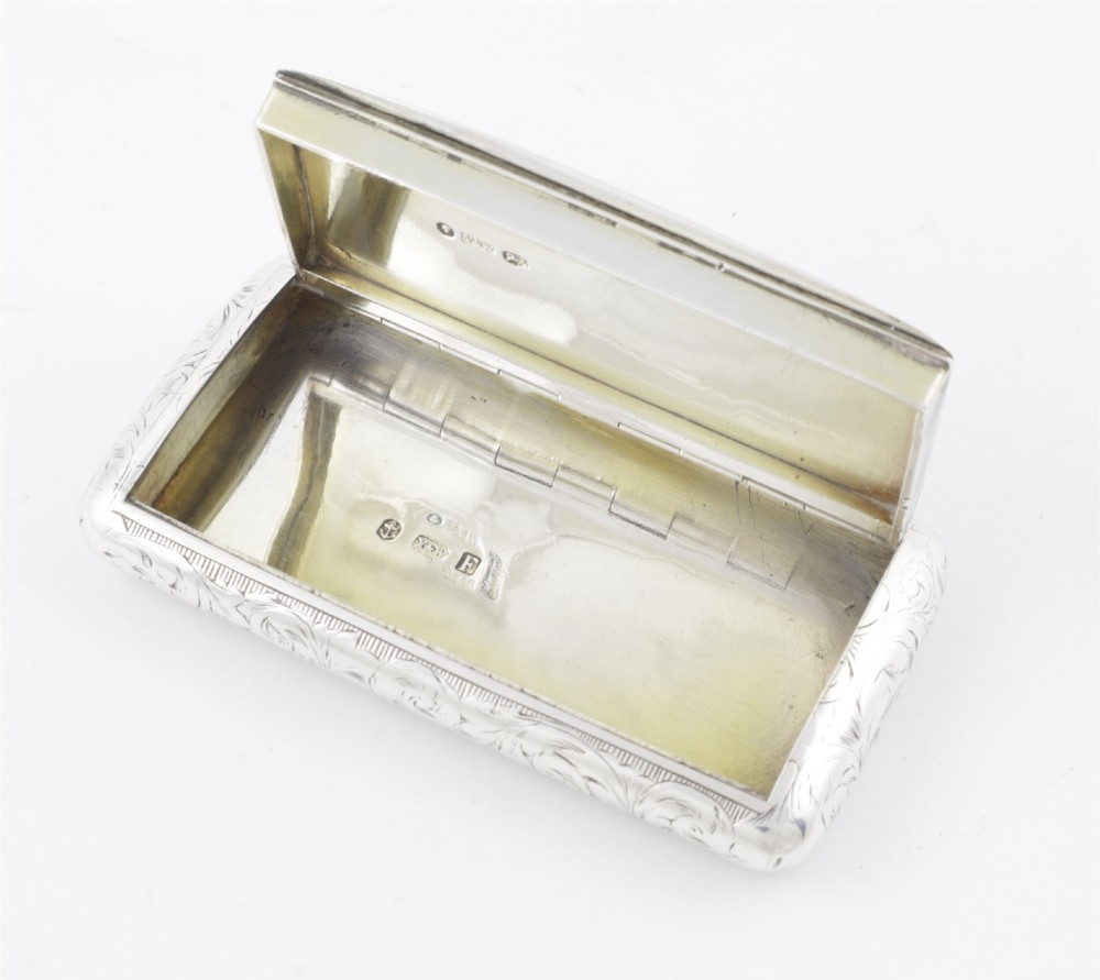 An engraved Victorian sterling silver rectangular snuff box featuring intricate foliate scrollwork and inscribed presentation text. View VII