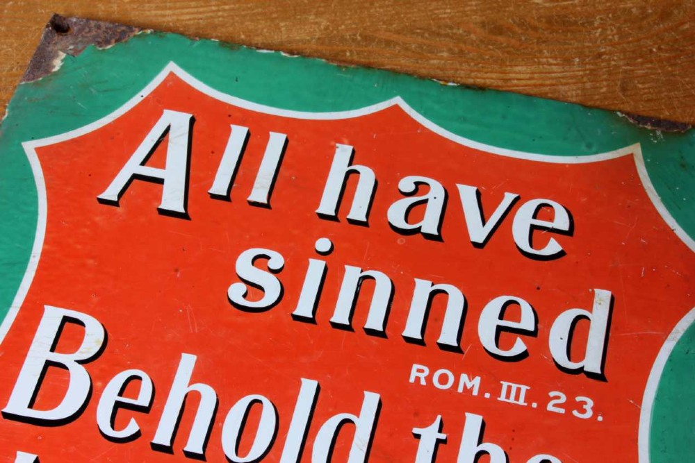 A rectangular vitreous enamel sign with a green background and a red central cartouche displaying white and black printed scripture texts. View III