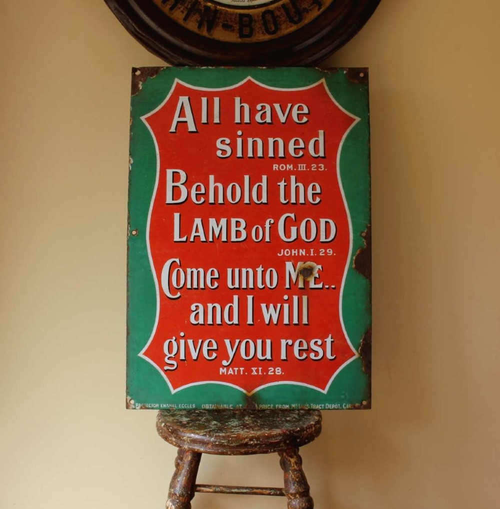 A rectangular vitreous enamel sign with a green background and a red central cartouche displaying white and black printed scripture texts. View VII
