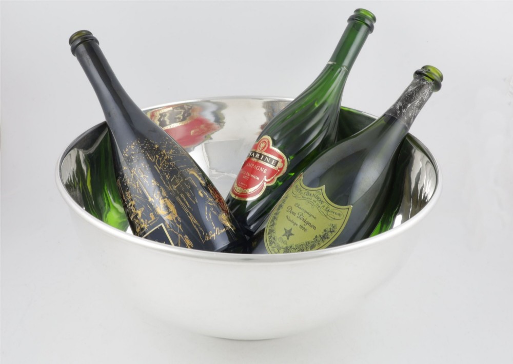 A large polished silver-plated champagne cooler bowl featuring a smooth circular basin, rolled rim, and pedestal base. View III