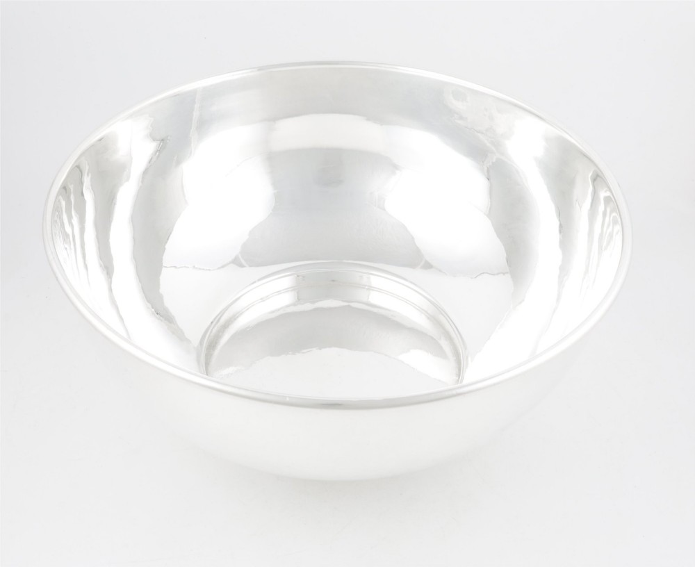 A large polished silver-plated champagne cooler bowl featuring a smooth circular basin, rolled rim, and pedestal base. View V