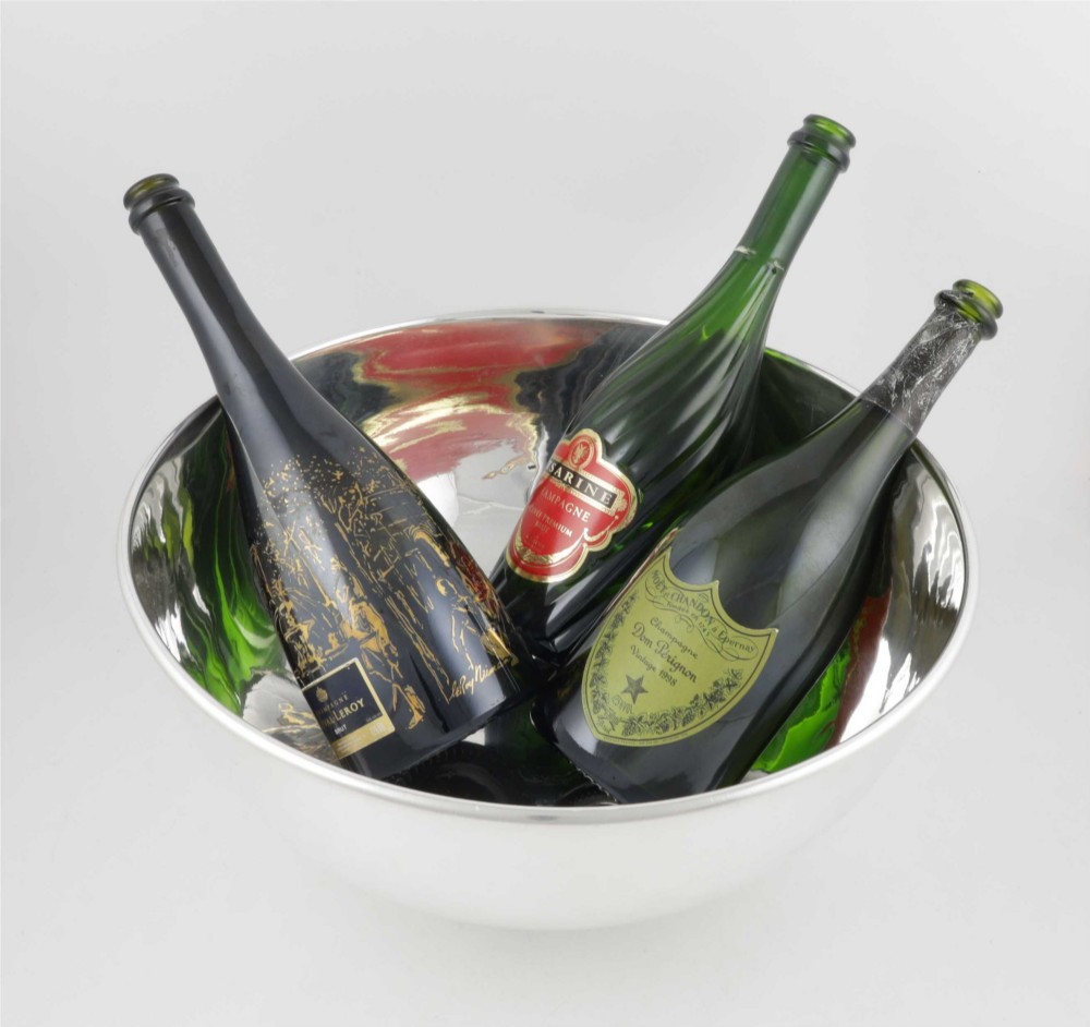 A large polished silver-plated champagne cooler bowl featuring a smooth circular basin, rolled rim, and pedestal base. View VII