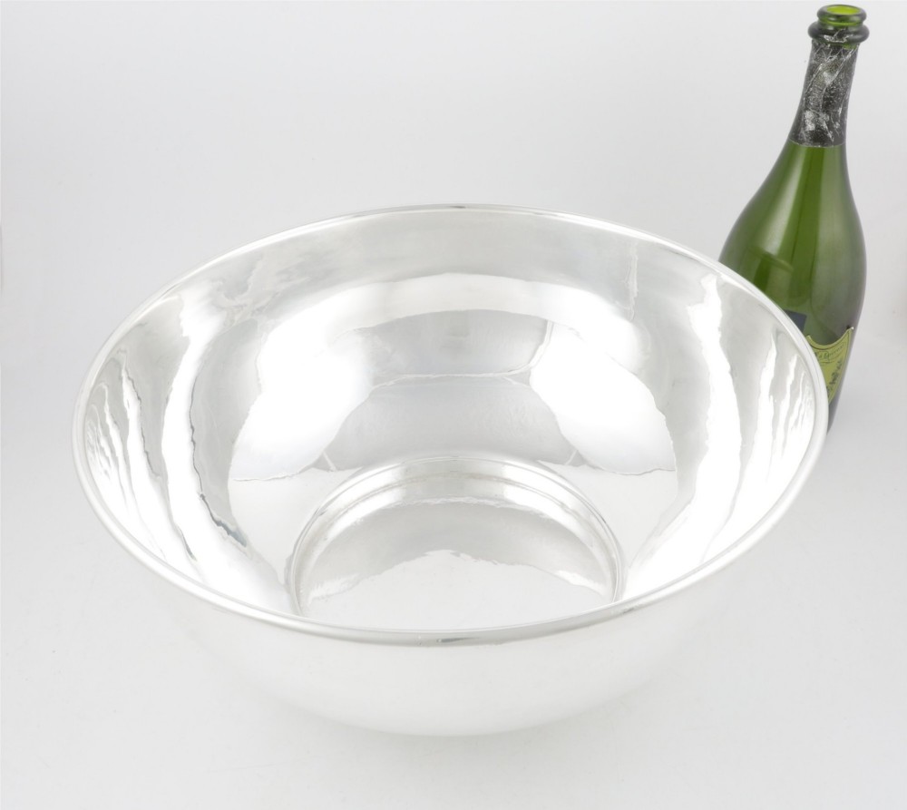 A large polished silver-plated champagne cooler bowl featuring a smooth circular basin, rolled rim, and pedestal base. View VIII