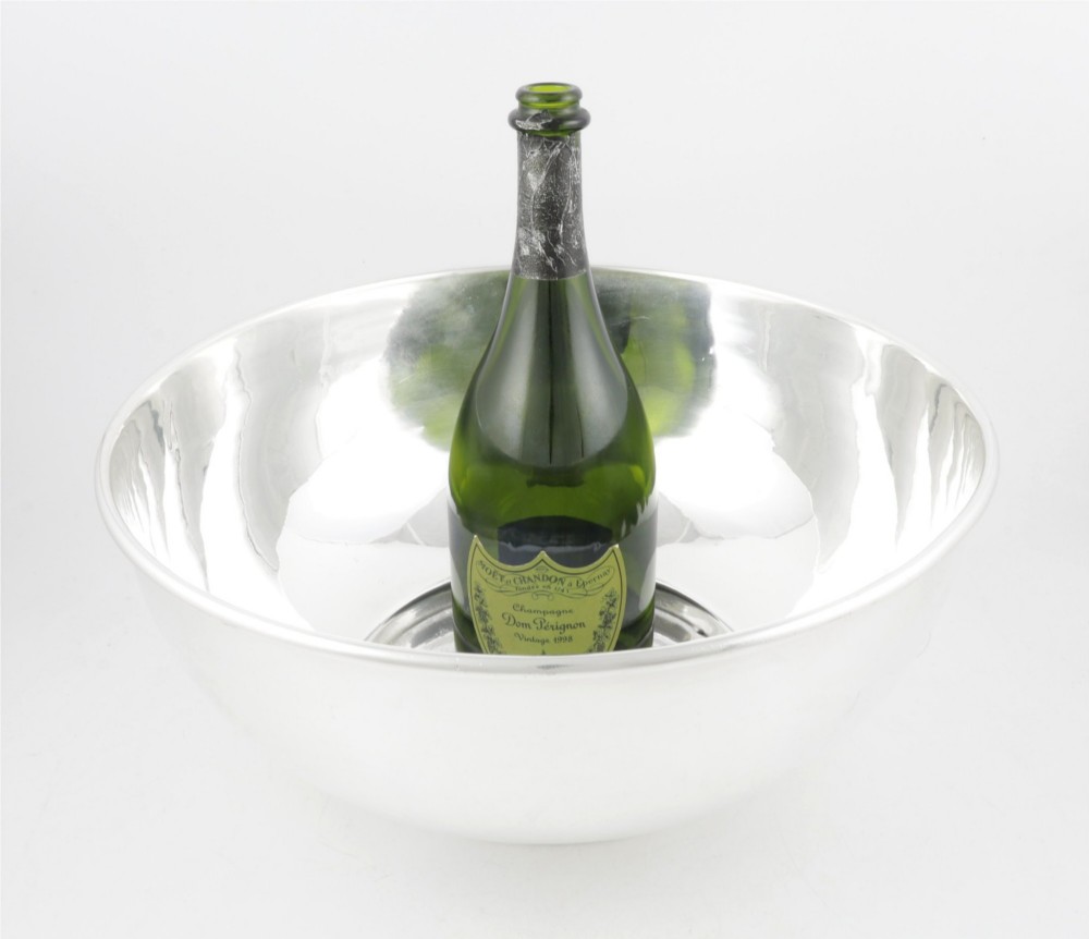 A large polished silver-plated champagne cooler bowl featuring a smooth circular basin, rolled rim, and pedestal base. View IX