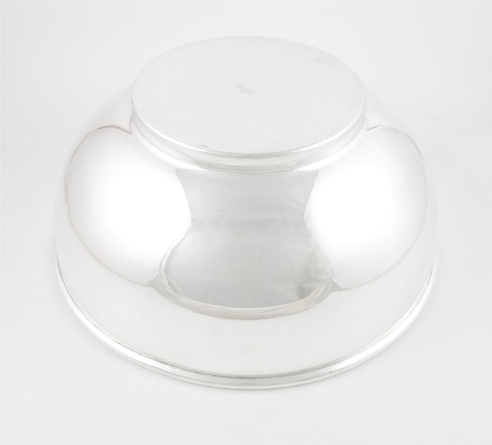 A large polished silver-plated champagne cooler bowl featuring a smooth circular basin, rolled rim, and pedestal base. View X