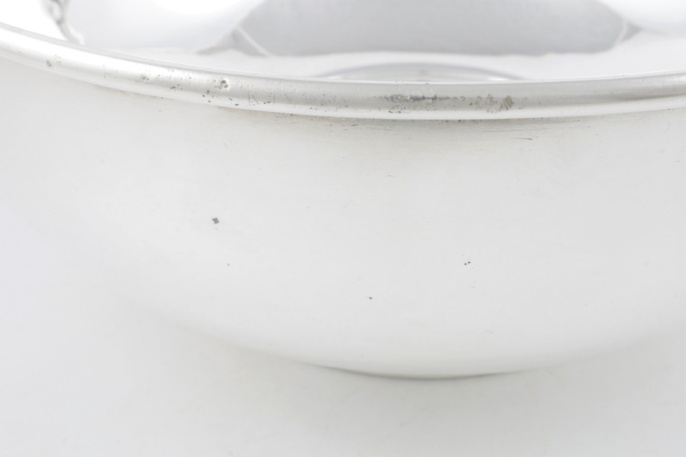 A large polished silver-plated champagne cooler bowl featuring a smooth circular basin, rolled rim, and pedestal base. View XII
