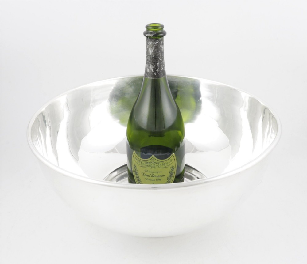A large polished silver-plated champagne cooler bowl featuring a smooth circular basin, rolled rim, and pedestal base. View XV
