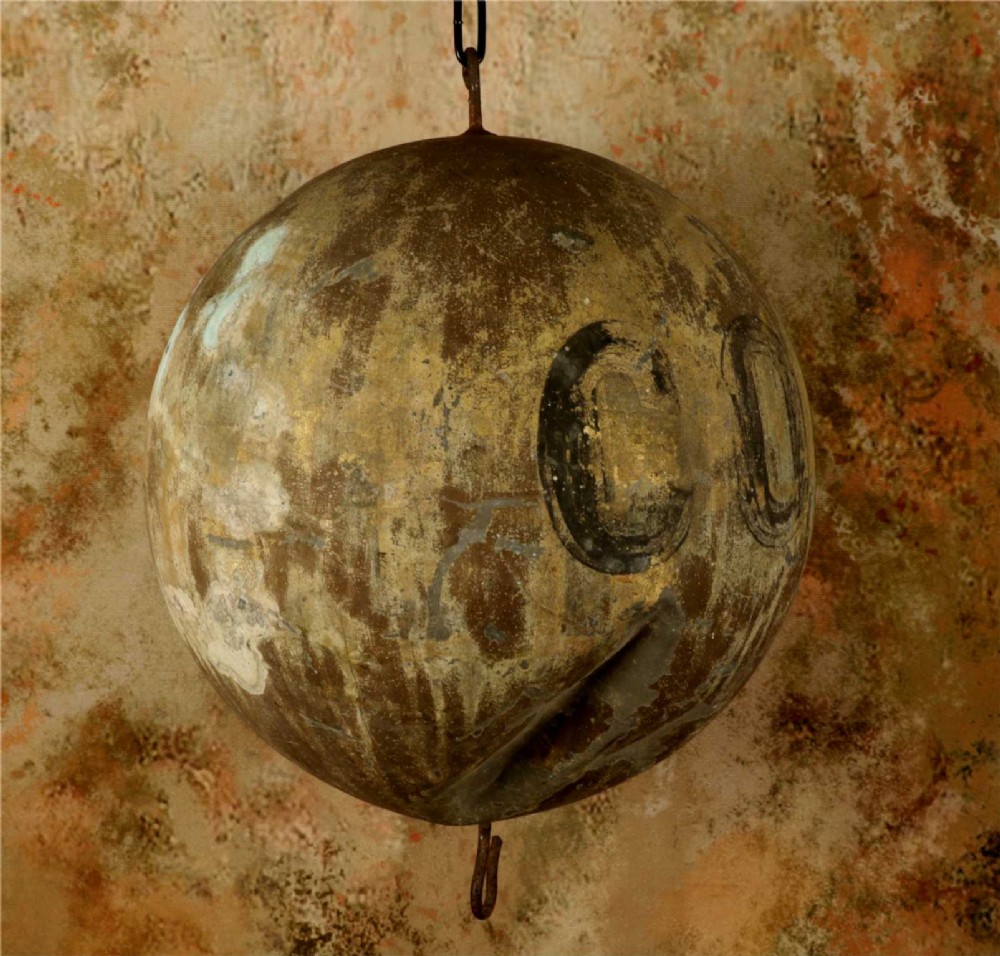 A 19th-century spherical zinc French coiffeur trade sign featuring hand-painted lettering and iron hanging hooks. View IV